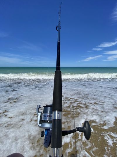 Top view of a fishing line in the surf.