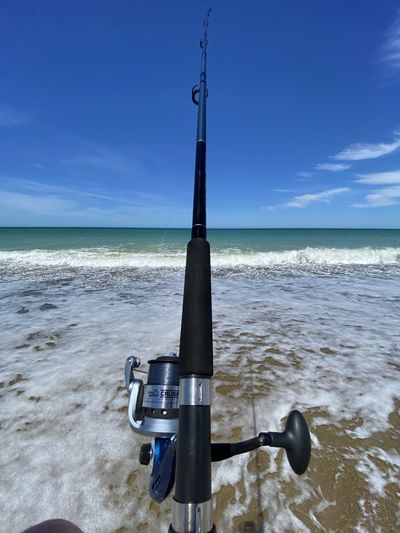 Top view of a fishing line in the surf.