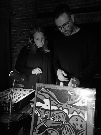 Photo of us at the turntables for Vinyl Vibes